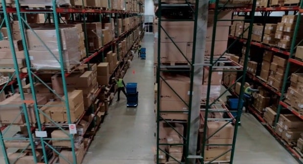 What is picking in a warehouse?